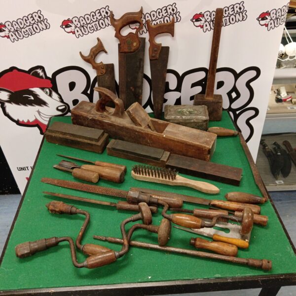 Selection of vintage woodworkers tools inc wooden blockplane brace drills chisels and oil stones