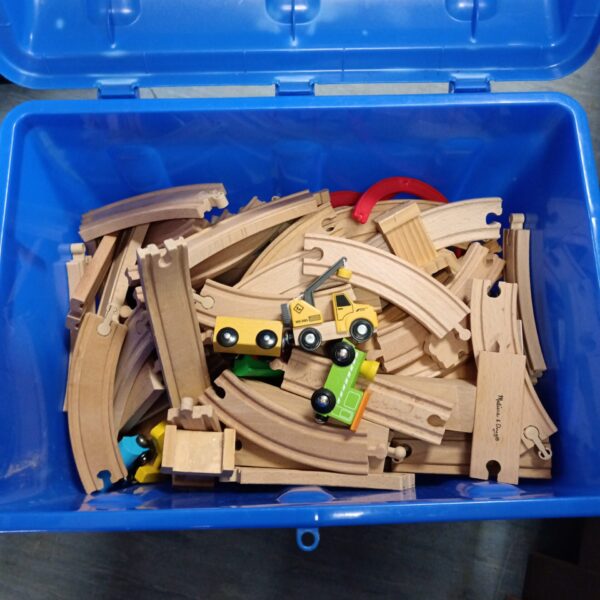 Bag of tomy playsets and box of wooden trains and tracks inc carosel