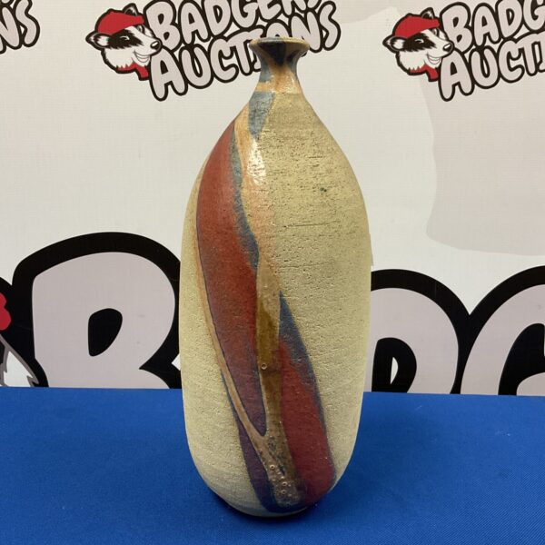 Vintage 1970s studio pottery vase with earthy tones.