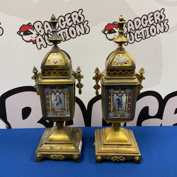 Pair of 19th-century gilded bronze garnishes with musketeer scenes.