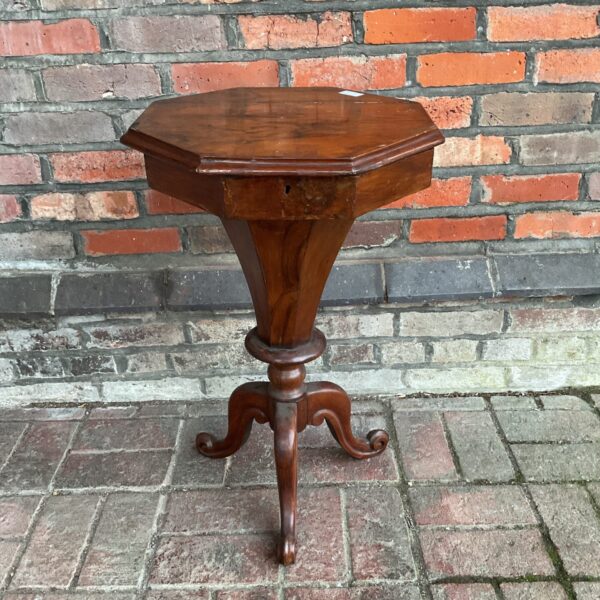 Antique 19th-century rosewood sewing table with octagonal top.