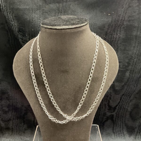 Two 925 silver chain necklaces displayed on a mannequin bust.