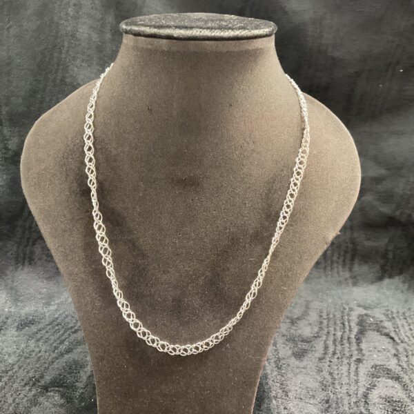 Elegant 925 silver double link necklace on a display stand.