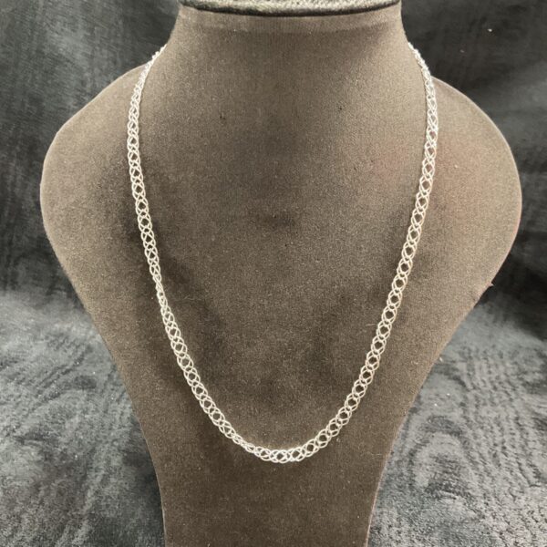 Delicate 925 silver double link necklace on a display bust.