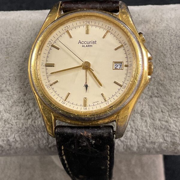Vintage Accurist alarm quartz wristwatch with black dial.