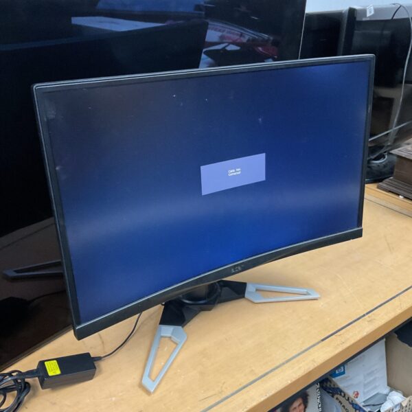 Acer 26 inch curved computer monitor displayed on a table.