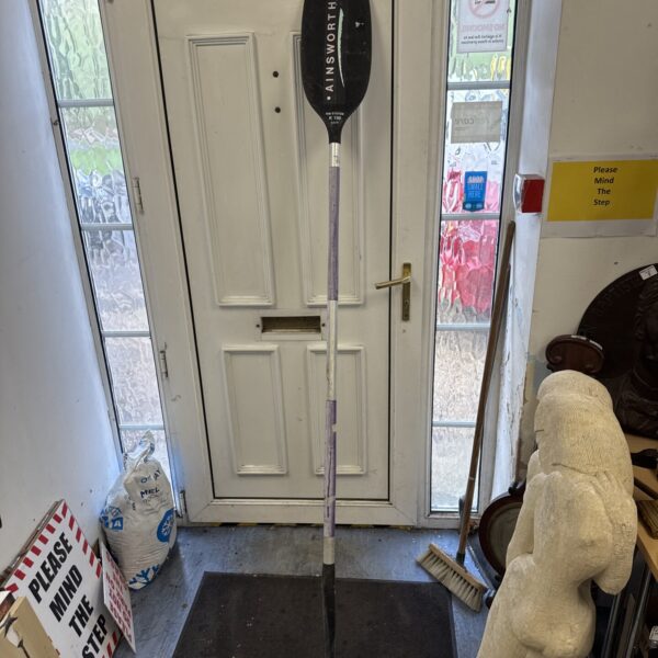 Ainsworth K100 slalom canoe oar in a doorway.