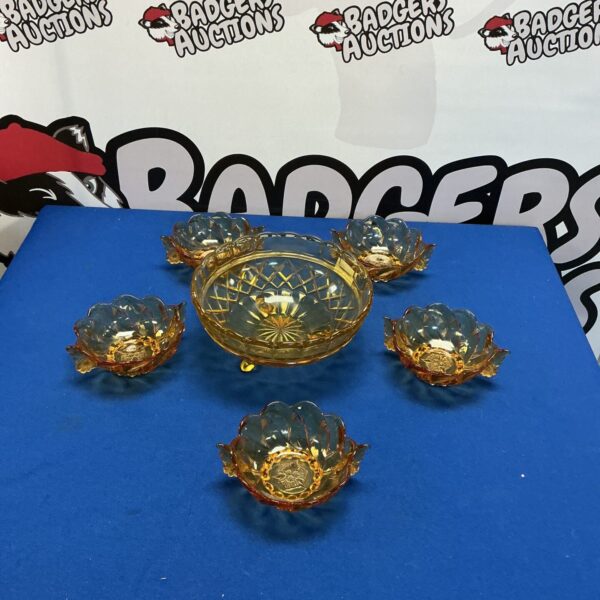 Vintage amber glass fruit bowl set with compote dishes.