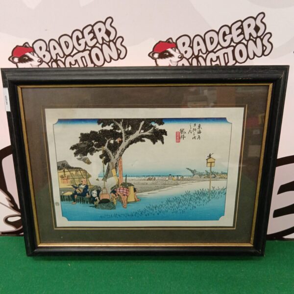 Vintage Ando Hiroshige woodblock print of travelers resting by a shelter.