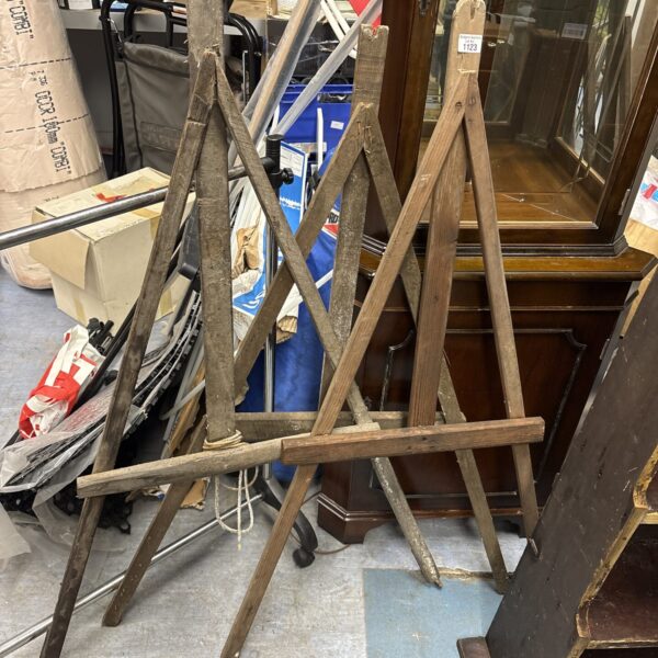 Lot of three antique wooden artist easels for painting.