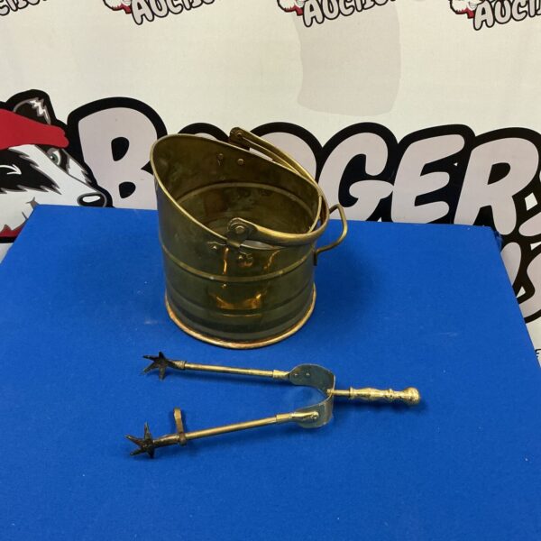 Antique copper coal bucket and tongs set for fireplace use.
