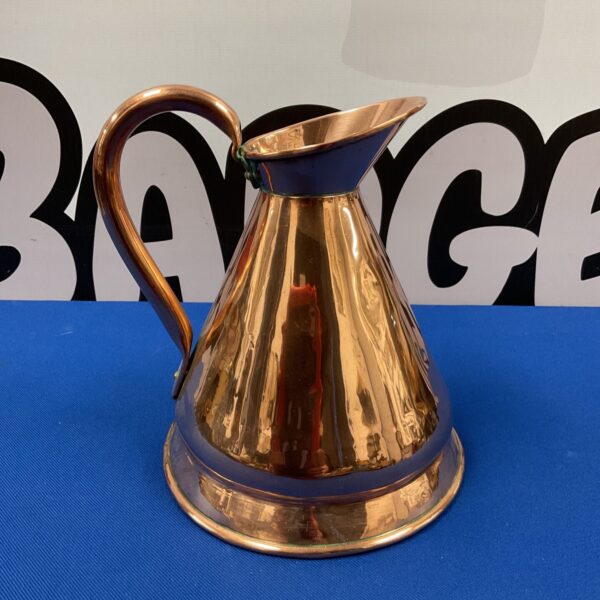 Antique copper flagon with a classic tapered shape.