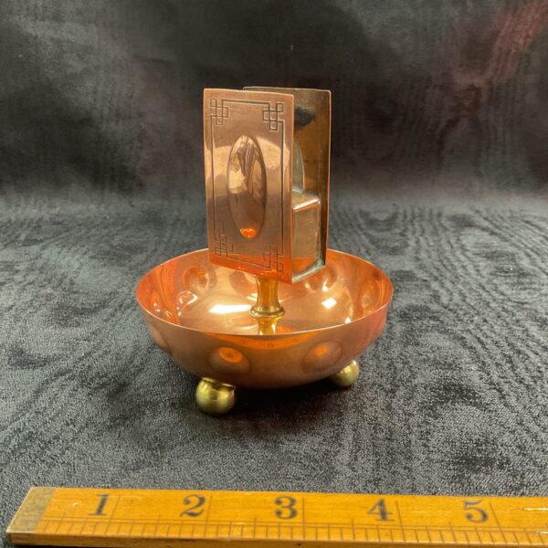 Antique copper match holder by Carl Deffner with geometric design.