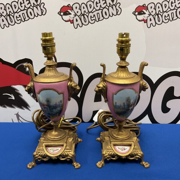 Antique garniture table lamps with porcelain and gilt detailing.