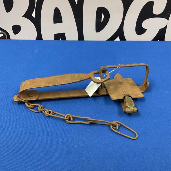 Antique iron jin trap with chain, vintage animal snare.