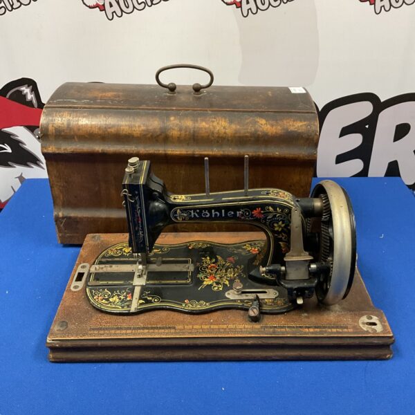 Ornate antique Kohler hand crank sewing machine, vintage collectible.