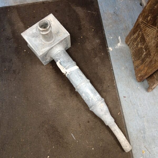 Antique lead drain hopper with weathered patina, vintage architectural salvage.