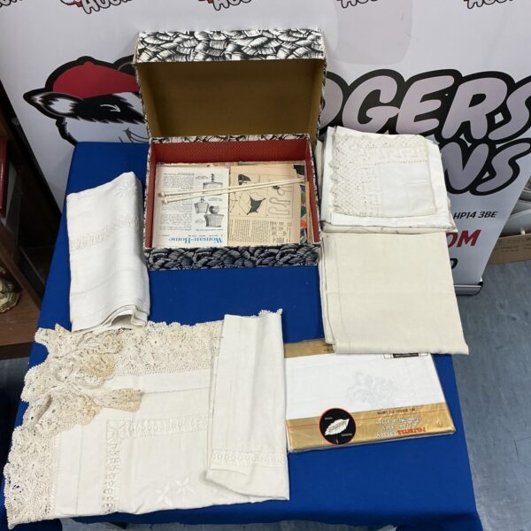 Antique linen tablecloths and covers in a vintage collection.