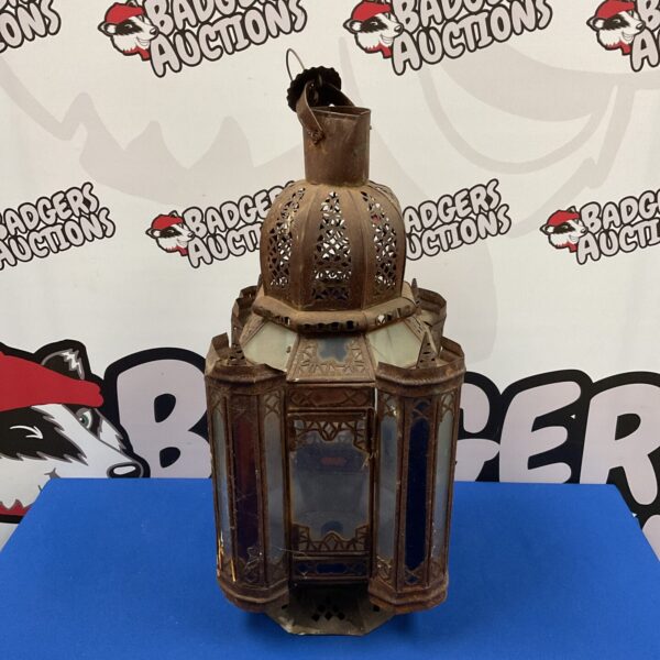 Antique Persian lantern with pierced metal and glass panels.