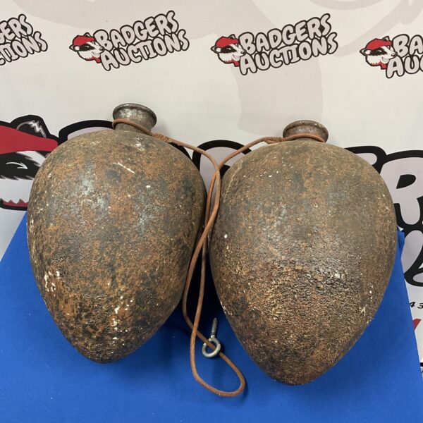 Pair of antique pottery water vessels with looped handles.