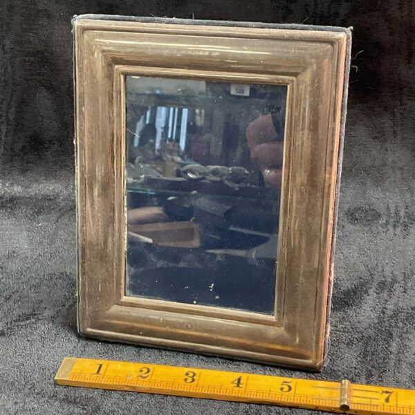Antique silver photo frame with hallmarked silver detailing.