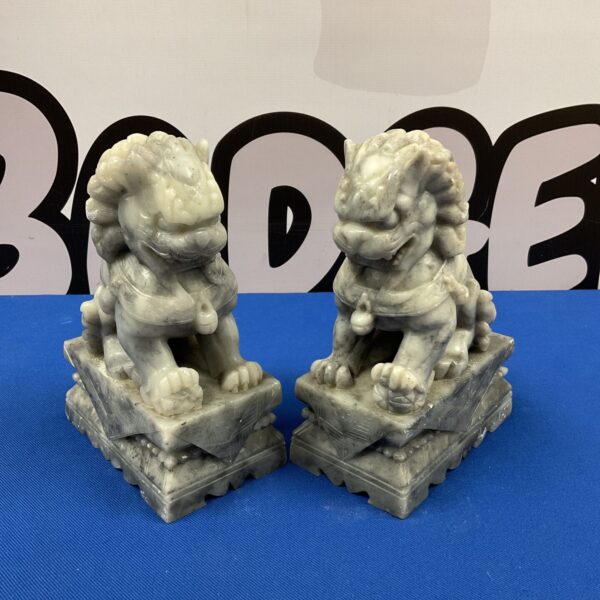 Antique pair of soapstone foo dogs, detailed carving.