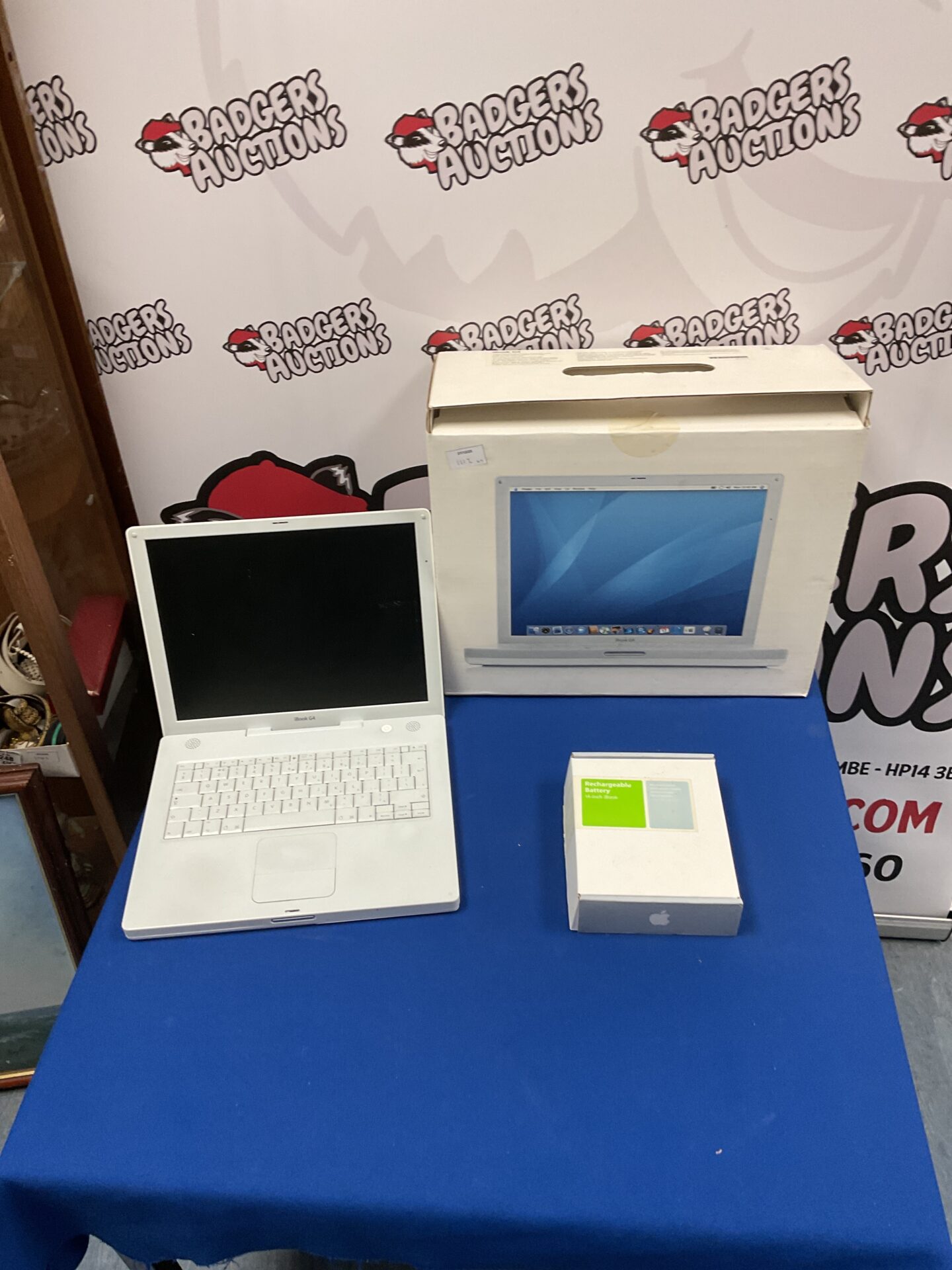 White Apple iBook G4 laptop in its original packaging.