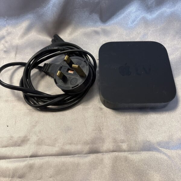 Front view of the Apple TV A1378 streaming device with power cable.