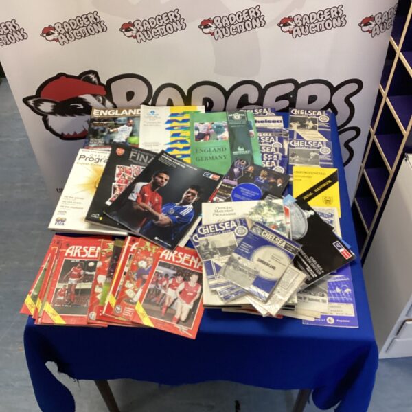 Vintage football programmes featuring Arsenal and Chelsea match details.