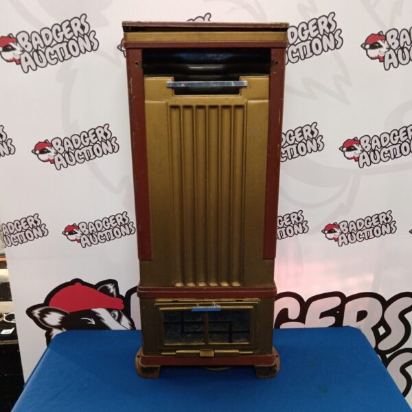 Vintage Art Deco cast iron gas fireplace with geometric design.