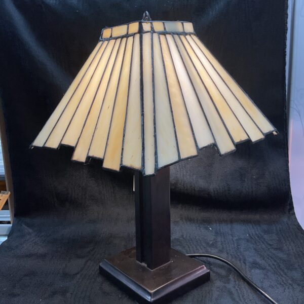 Vintage Art Deco table lamp with amber stained glass shade.