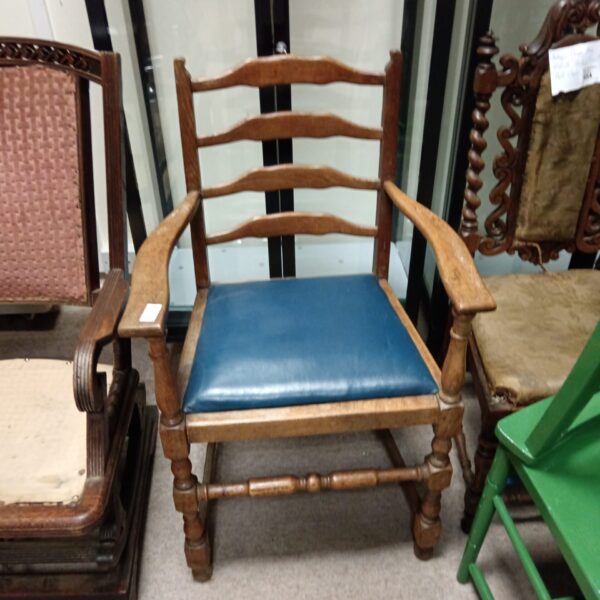 Vintage Arts and Crafts oak armchair with reupholstered seat.