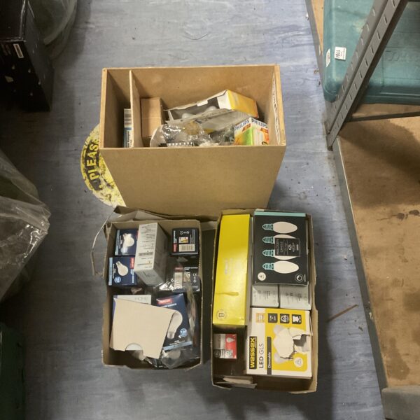 Boxes of assorted light bulbs, including Philips branded bulbs.
