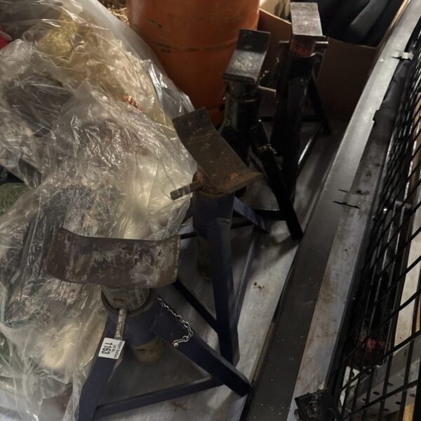 Lot of four heavy-duty axle stands for vehicle maintenance.