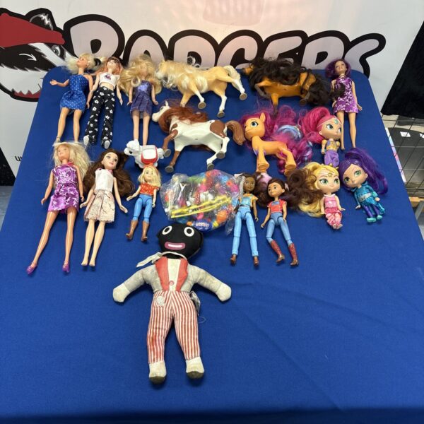 Barbie doll lot with vintage golly doll and horse figurines.