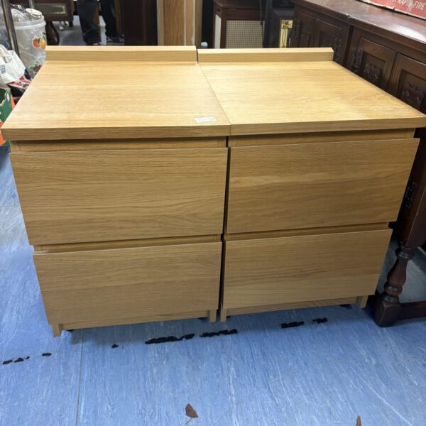 Pair of beach effect nightstands with two drawers.
