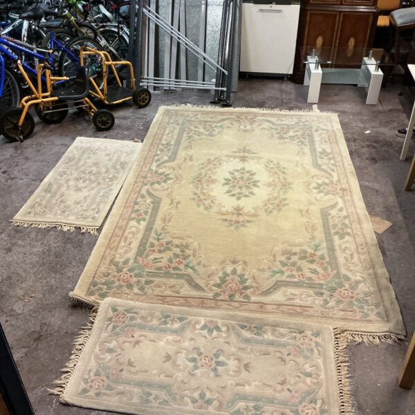 Beige floral rug set with a large 9x6 rug and smaller rugs.
