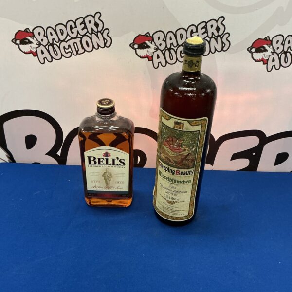 Vintage Bells Whisky and Mosel Wine bottles in a collectible lot.