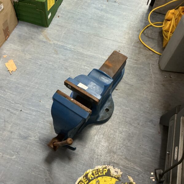 Heavy-duty bench vice for workshop and metalworking tasks.