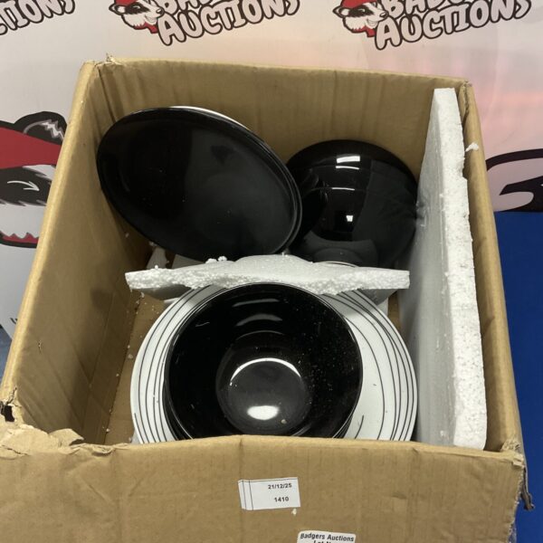 Collection of black ceramic bowls for kitchen or dining.