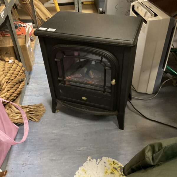 Black electric fireplace with realistic flame effect for home heating.