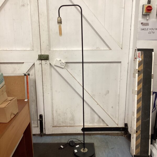 Black adjustable standard lamp with a circular base.