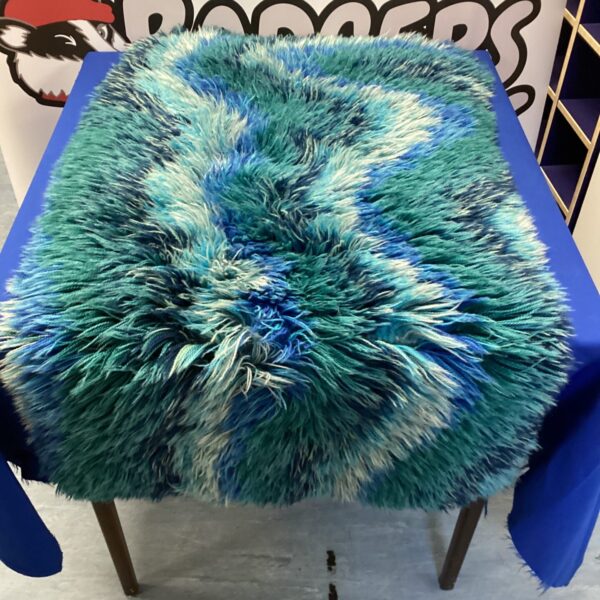 Textured blue and green wool rug for home decor.