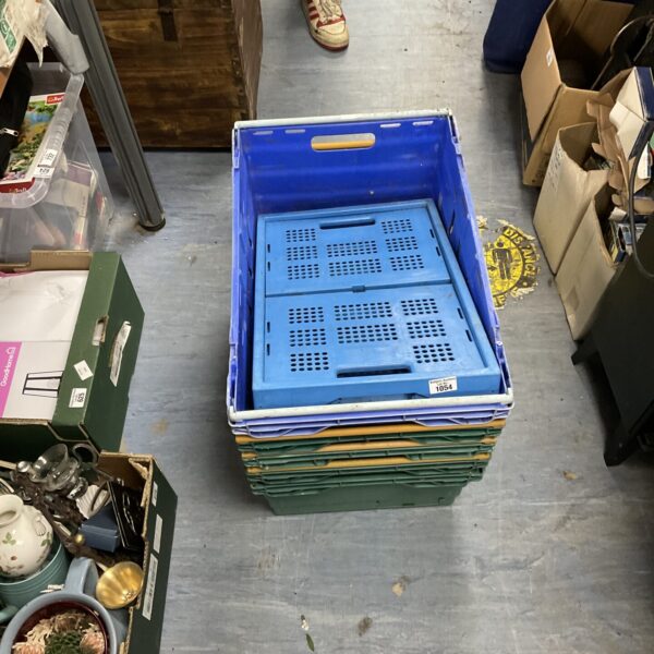 Blue plastic stake removal crates for garden storage.