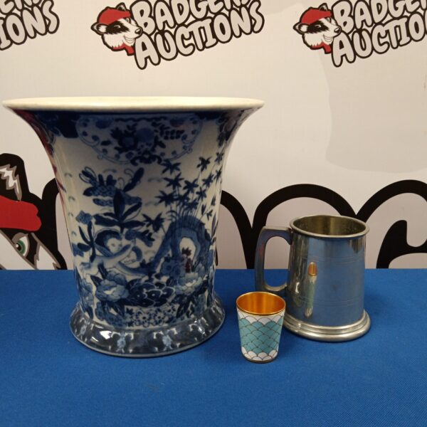 Vintage blue and white porcelain planter with pewter tankard and enamel measure.