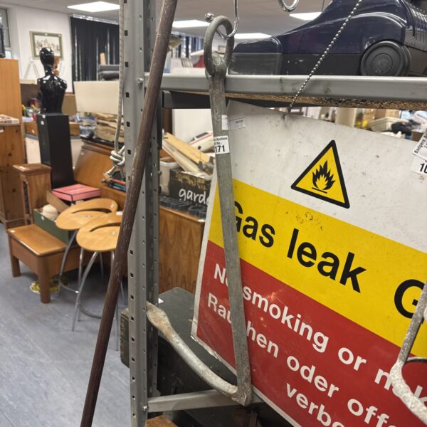 Vintage boat drag anchor, showing signs of wear and corrosion.