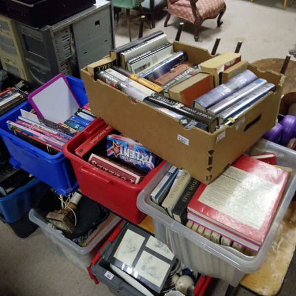 Mixed paperback books in boxes, a vintage book lot.