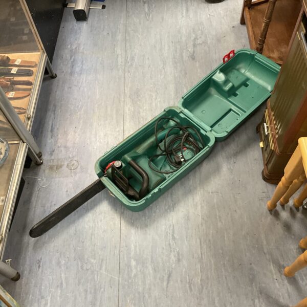 Vintage Bosch electric chainsaw in its original carrying case.
