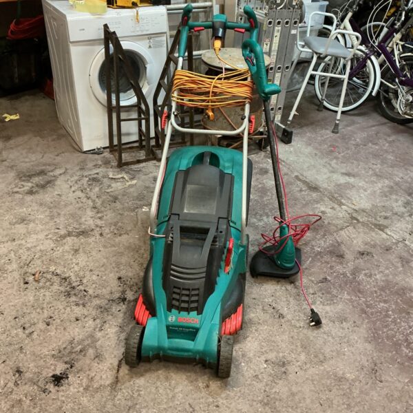 Bosch lawnmower and strimmer set for garden maintenance.