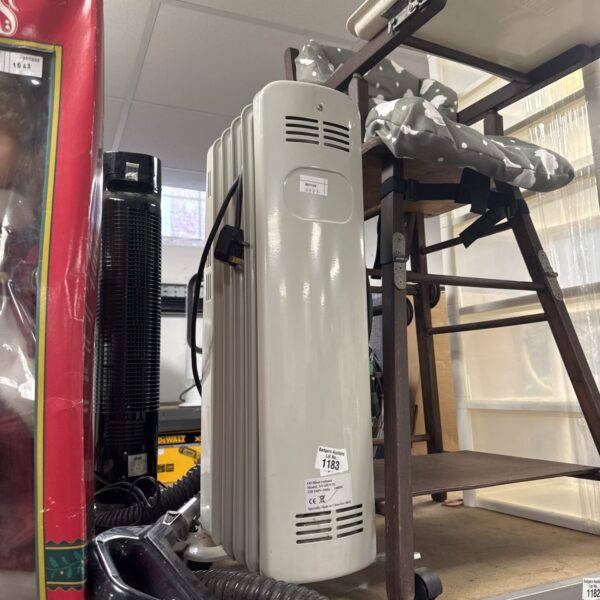 White B&Q oil filled radiator with wheels for portable heating.